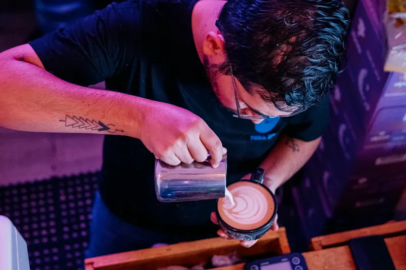 Barista pouring latte art